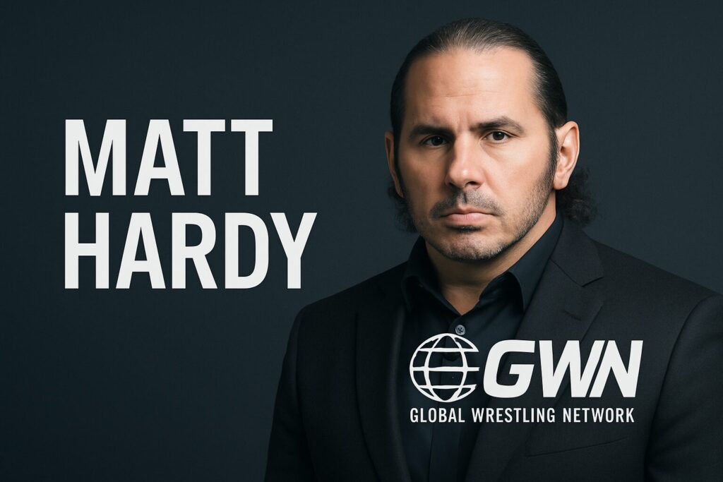 Serious man in suit beside wrestling logo